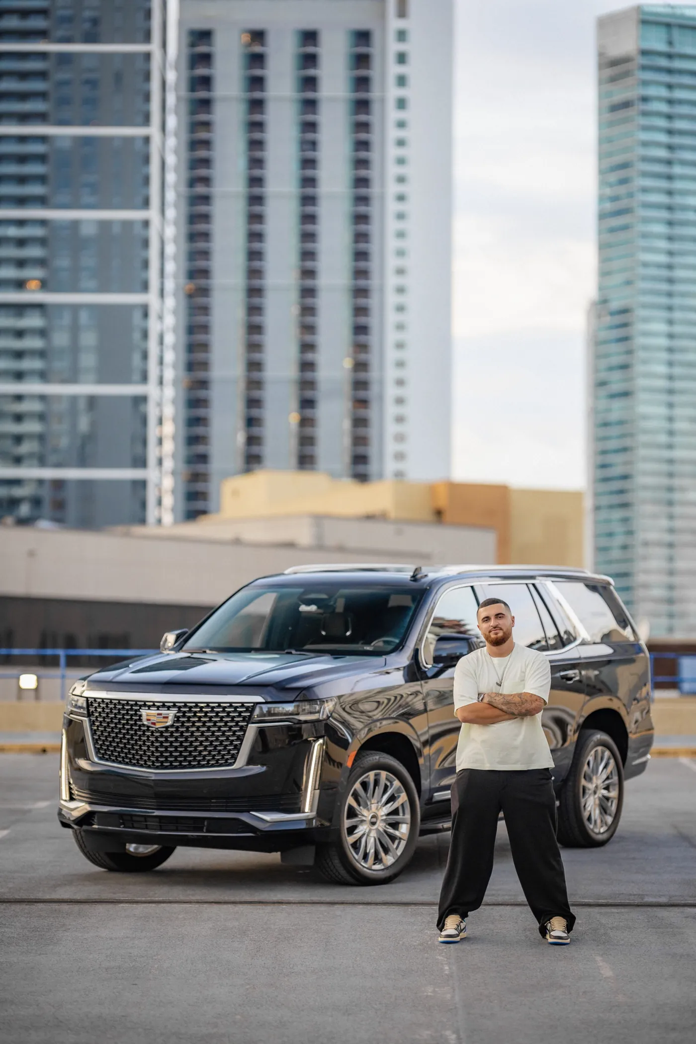 Aren, founder of AG Motors Miami, with a Cadillac Escalade in Miami